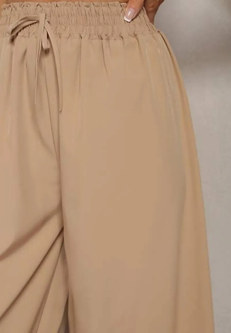 Beżowe Spodnie High Waist z Szerokimi Nogawkami z Wiskozą Wykończone Gumką w Talii Crisantas